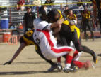 Eddie Allan strong arming the tackle